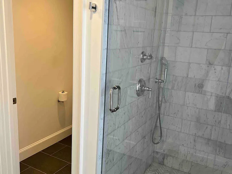 Master bath, enclosed toilet and walk in shower