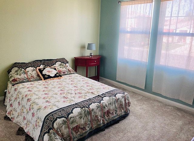 Queen size bed. Newer Box frame. Good mattress. Can bring own bedding or use provided linens. New carpet. 

You can see out but passerbys cannot see through curtains. Lamp is low level light for relaxing and reading.