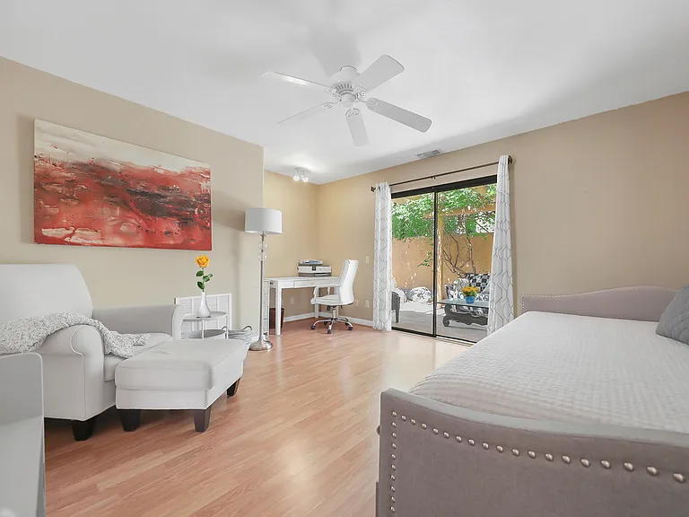 Room with sliding door to private patio