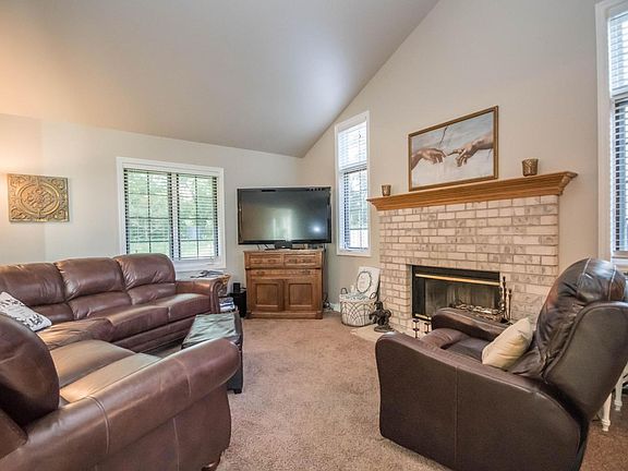 Vaulted living room with fireplace