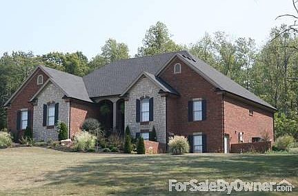 Private screened in porch w view of 2 (truck, boat, trailer) detached garage.