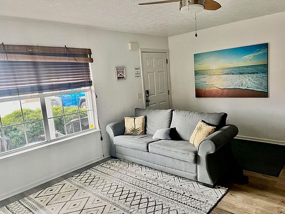 Large living room with lots of natural light and queen sized sofa sleeper