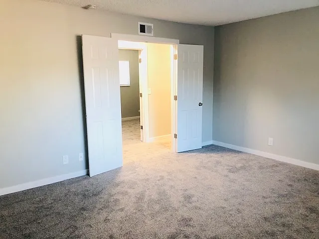 large master bedroom opening to second bedroom
