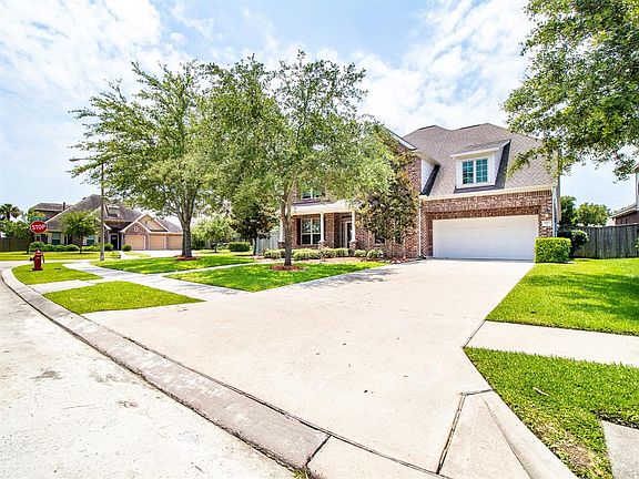 Long driveway and mature trees.