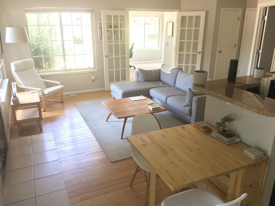 The light-filled living room opens to the second bedroom, wh