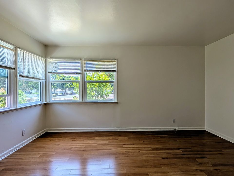 Living Room with windows overlooking yard
