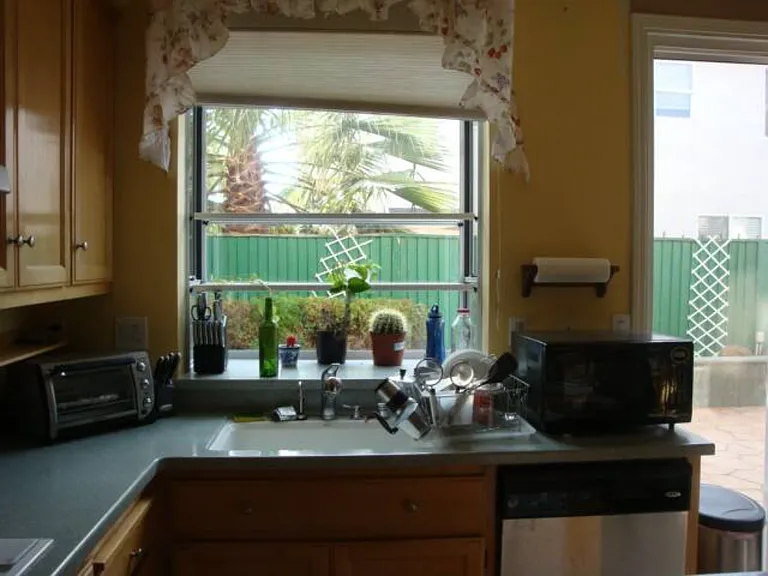 Kitchen opens to backyard