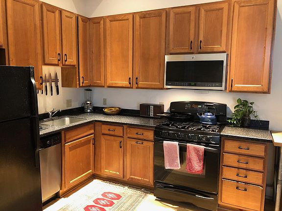 Kitchen with gas range stove, dishwasher, and built in microwave