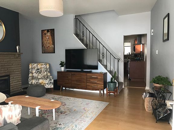 Livingroom with a gas working fire place, high ceilings and brand new double pane windows.