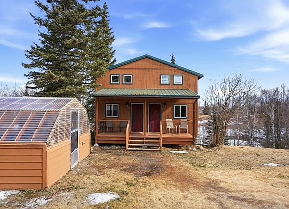 Front of duplex. Available unit is on the left