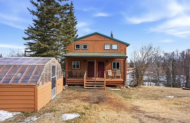 Front of duplex. Available unit is on the left