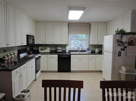 Beautiful remodeled kitchen with lots of cabinets and counter space.