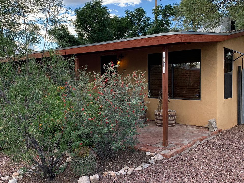 House Front with porch, swing, and off street parking