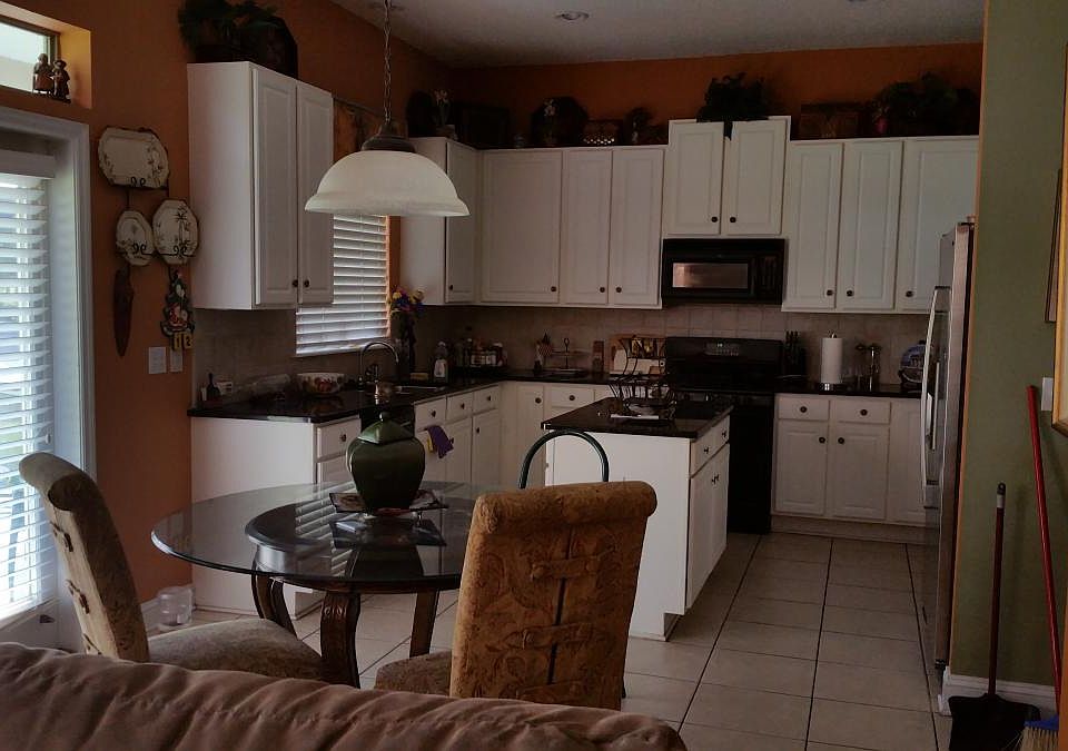 Large kitchen granite counter tops with lots of cabinets