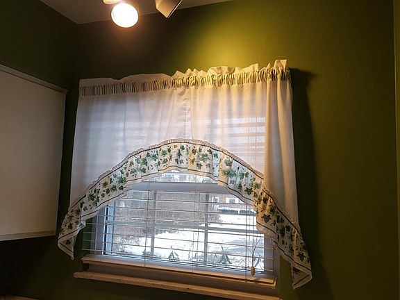 Kitchen over-the-sink light and window.