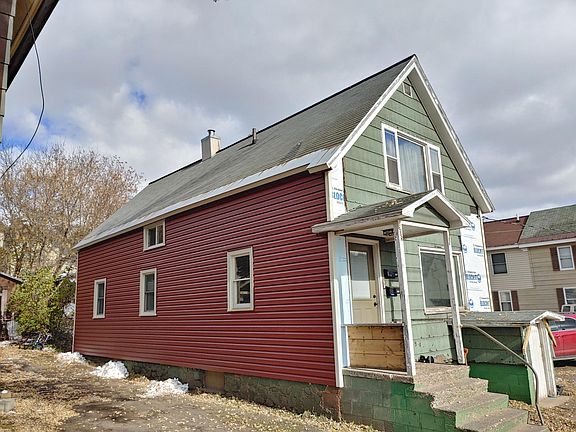 Front and side view from street (front of house siding and foundation painting will be completed before occupants move in)