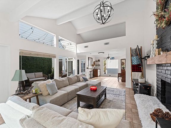 Spacious living room with ample natural light.