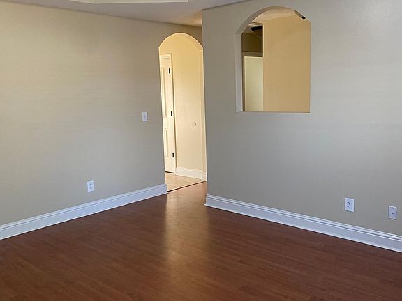 Den looking towards the entrance and the kitchen