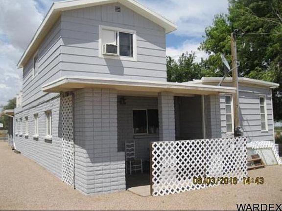 Covered patio along back of home