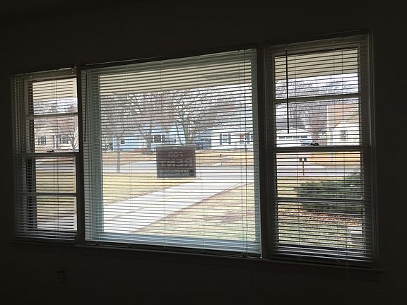 Large living room window provides nice light area with new vinyl plank flooring