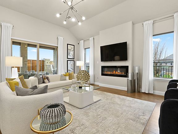 REPRESENTATIVE PHOTO - Living room in the Rapport home plan by Trophy Signature Homes