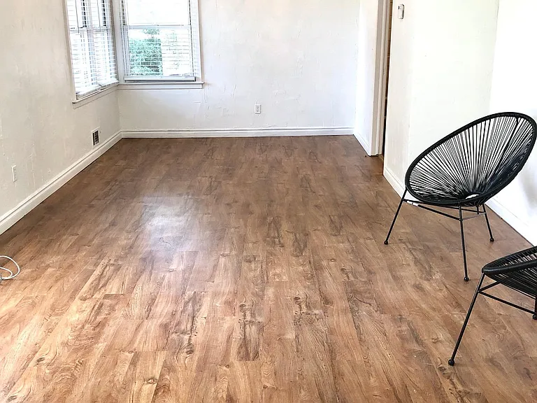 Open plan living & dining rooms. New vinyl flooring and lighting. 2" blinds throughout.