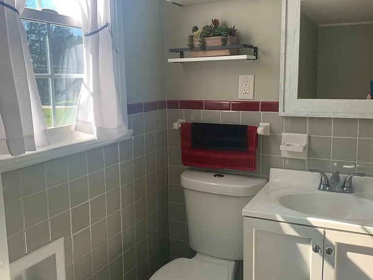 Private bathroom off larger bedroom on this end of house.