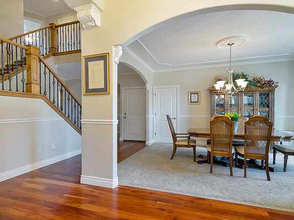 Inside front door to right