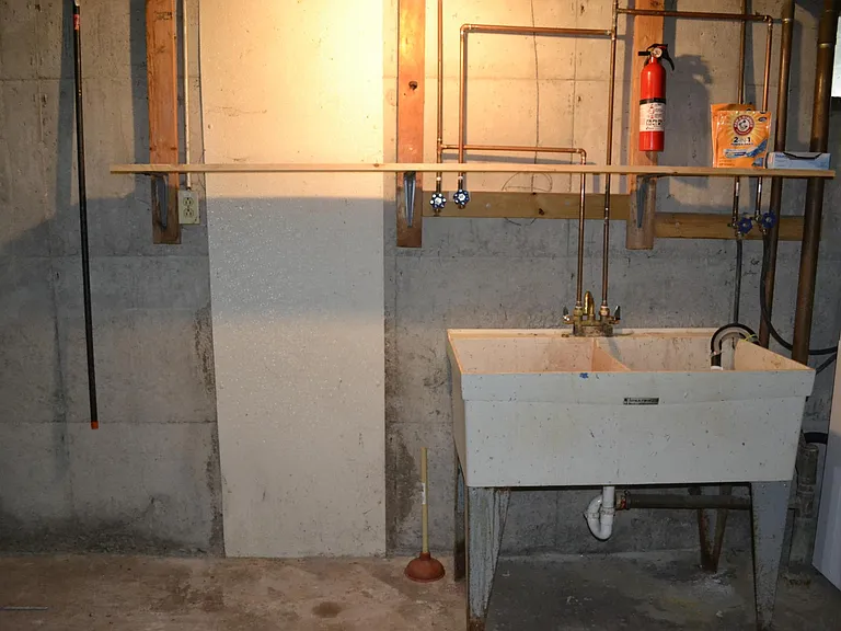 Shared basement has washer/dryer hookups. There is shelving available for storage.
