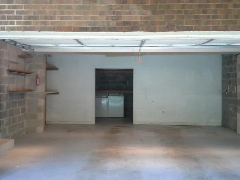 2 CAR GARAGE WITH WORKSHOP AND EXTRA REFRIGERATOR IN GARAGE