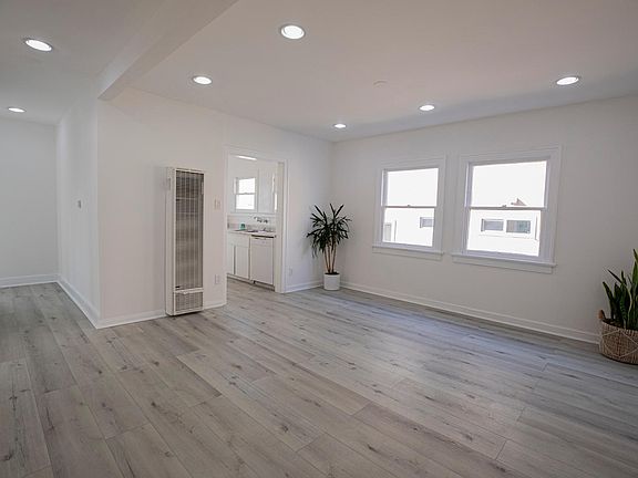 Potential Living room and/or dining room space with wonderful natural light with wall heating unit.