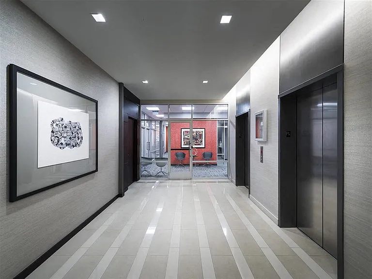 Elevator waiting area between our business and fitness center