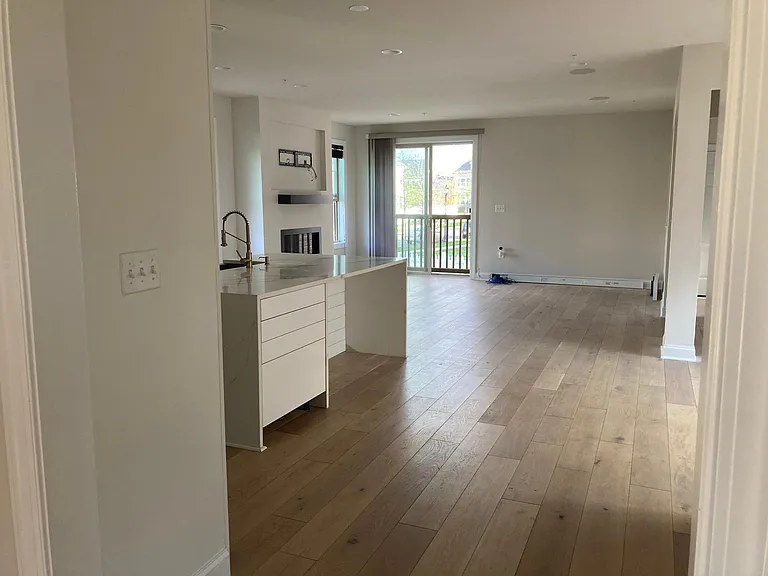 Foyer leads into open kitchen and great room