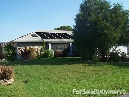Outside view of house and lawn. : House as seen from Paar Circle with large Red Cedar tree. Only 8 h