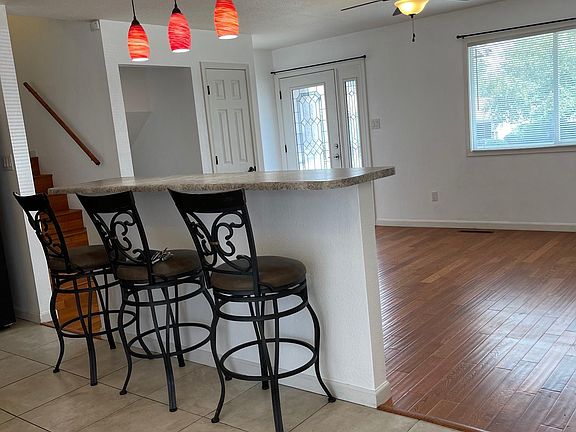 View to the front door entrance. Large windows let in a great deal of light. Coat closet just inside the front door.