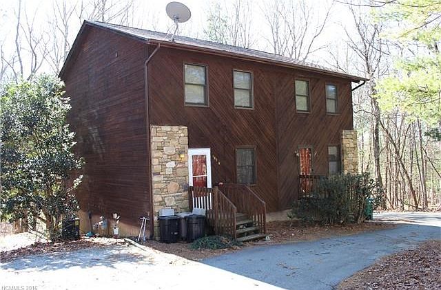 Well-maintained wood and stone exterior