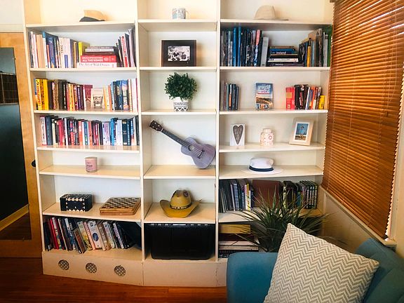 Bedroom 1. Downstairs room with built-in bookcases. Also perfect for an office.