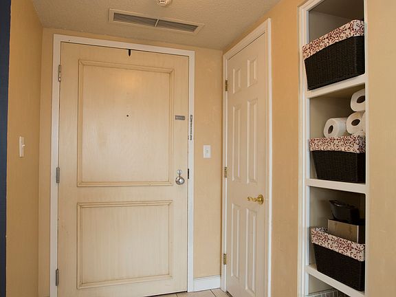 Foyer has a coat closet and storage