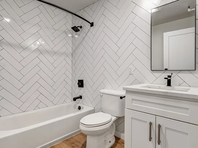 Welcome to Luckey Platt, where modern design meets comfort. This stylish bathroom features elegant herringbone tile, sleek fixtures, and ample natural light, perfect for relaxation. Don't miss the chance to make it yoursschedule a tour today!