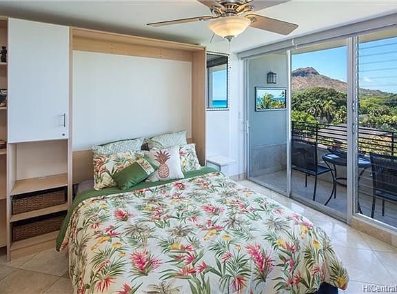 Custom cabinetry and bookshelves are integrated into the queen sized murphy bed.