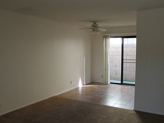 Tiled Dining area with access to side patio
