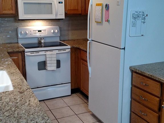 Kitchen with built in microwave, dishwasher, refrigerator, stove