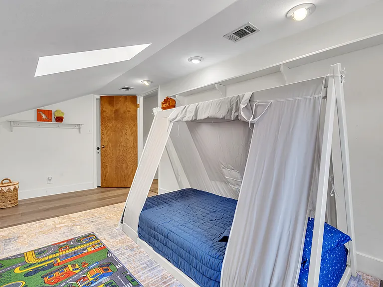 An additional Twin Bed is now added in the corner where the wicker basket stands!