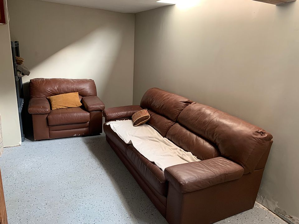 Living area with south facing street level windows