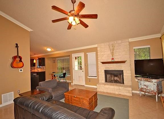 Family room is open to kitchen and to back deck.  High ceilings and Fireplace!