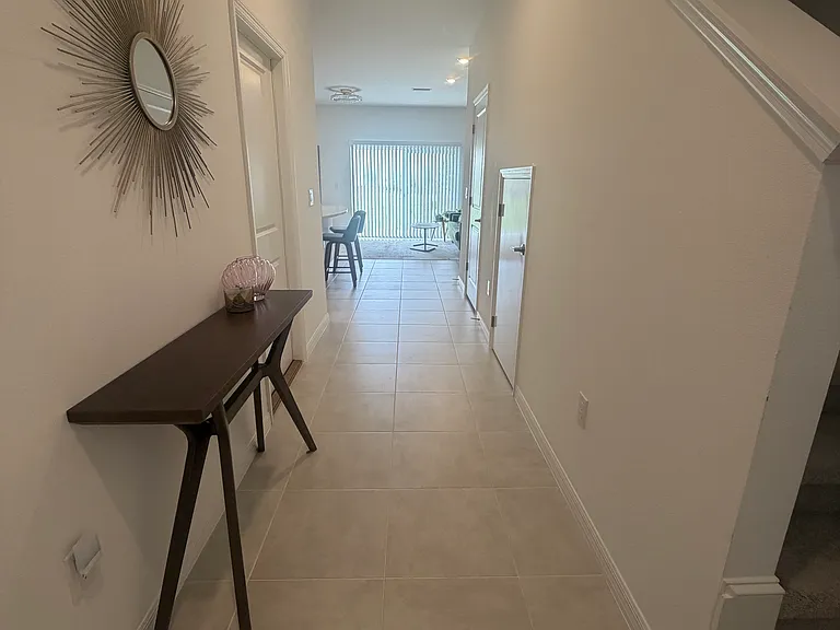 Entry way. Tile floors throughout bottom level.