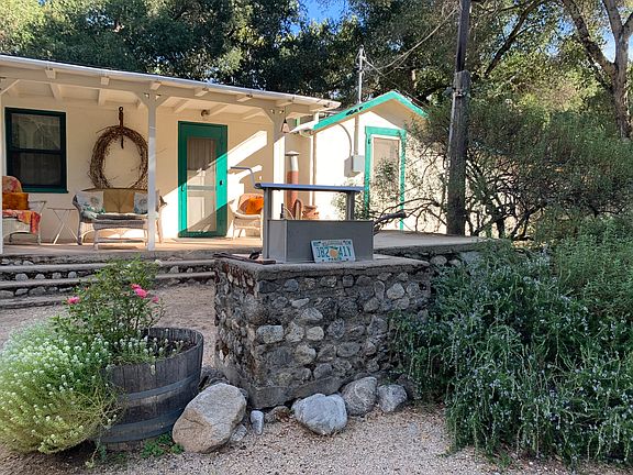 Front of cottage with stone BBQ
