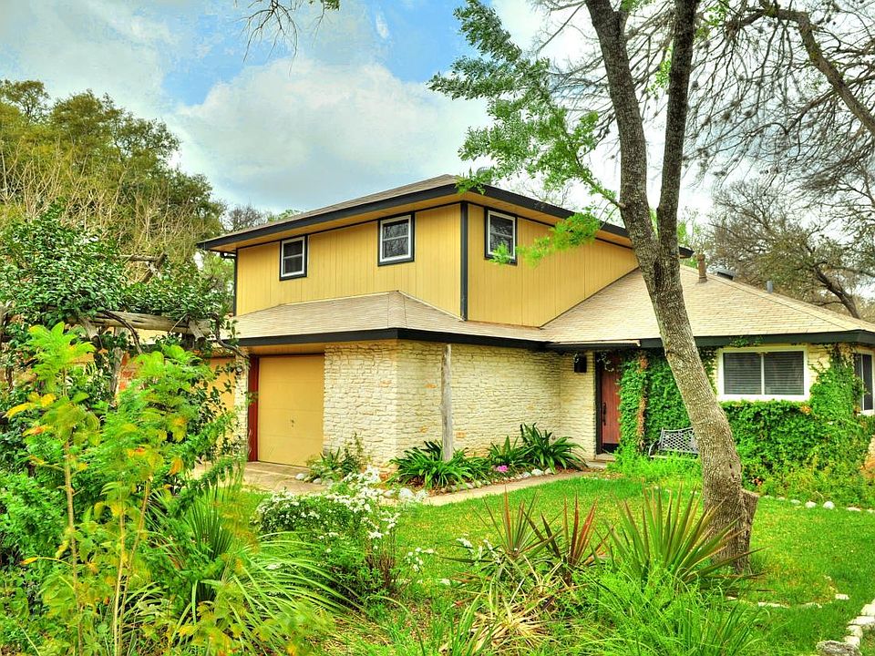 Charming updated home with great flow and luscious landscapi