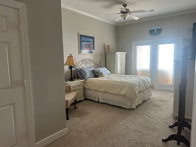 Master bedroom. River views from your bed. Door going out to balcony.