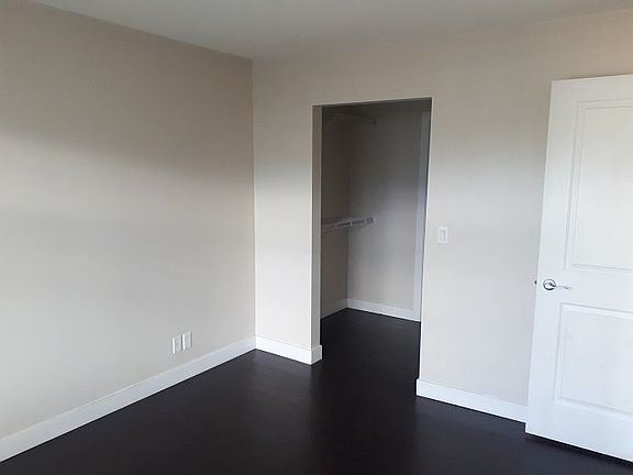 Bedroom with walk-in closet